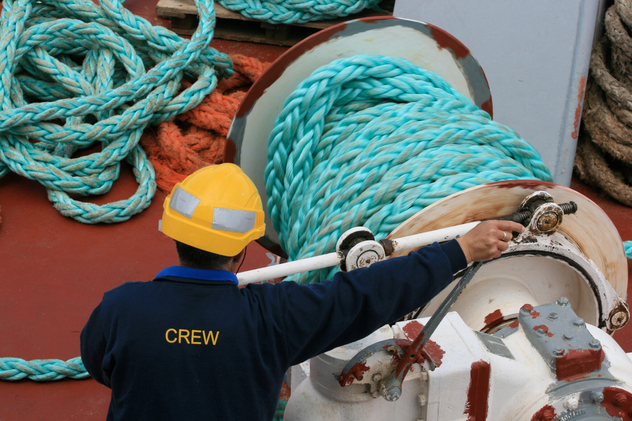 Ship crew member carrying out deck operations